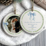 Grandmillenial Bows First Christmas Married Photo Ceramic Tree Decoration<br><div class="desc">Grandmillennial “Our First Christmas Married” photo ornament with watercolor blue bows and green laurel wreath is a charming keepsake that celebrates love with timeless elegance. The front features romantic serif and script fonts in classic blue, encircled by a soft green leafy border and topped with a hand-painted blue ribbon illustration....</div>