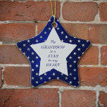 Grandson Star Pattern Keepsake Ceramic Tree Decoration<br><div class="desc">This is a wonderful Christmas ornament for a grandparent to give to a grandson. It features a silver star shape set against a star studded blue background. In the centre is your customised text in dark blue. Currently, the text says "My grandson is the star in my heart". The text...</div>