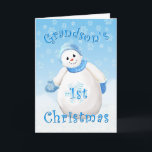 Grandson's First Christmas Snowman Greeting Card<br><div class="desc">A flurry of snowflakes surround this smiling snowman all decked out in fuzzy blue hat and mittens. A delightful Christmas design for your grandson's first Christmas greeting card. Personalize the inside verse using the template provided. I specialize in custom-made designs, contact me if you would like a unique 1st Christmas...</div>