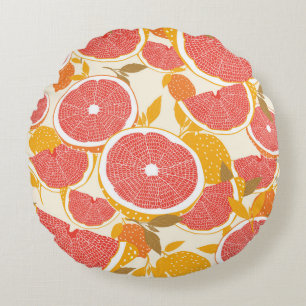 Grapefruit and halved slices with leaves on white. round cushion