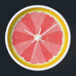 Grapefruit Slice Pop Art Minimalist Kitchen Food Wall Clock<br><div class="desc">This colourful grapefruit clock is perfect for your kitchen or breakfast nook decor. It shows a sliced open image of a grapefruit citrus fruit half with 12 slices in alternating shades of pink, so you can tell time without numbers. This unusual design has a textured look - and sort of...</div>