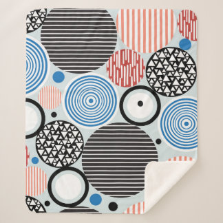 graphic pattern of multicolored circles of differe sherpa blanket