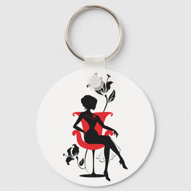 Graphic silhouette of a woman sitting in red chair key ring (Front)
