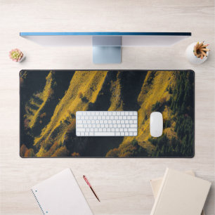 Grass covered mountain in autumn desk mat
