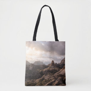 GRASS FIELD NEAR HILLS UNDER CLOUDY SKY AT DAYTIME TOTE BAG