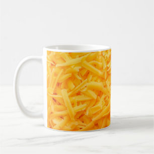 grated cheddar cheese top view coffee mug
