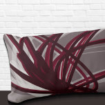 Gray and Burgundy Artistic Abstract Ribbons Lumbar Cushion<br><div class="desc">Gray and burgundy lumbar pillow features an artistic abstract ribbon composition with shades of burgundy and grey with white accents on a gray background. This abstract composition is built on combinations of repeated ribbons, which are overlapped and interlaced to form an intricate and complex abstract pattern. The gray, burgundy, white...</div>