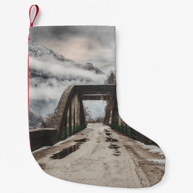 GRAY CONCRETE ARCH BRIDE BESIDE LEAFLESS TREE NEAR SMALL CHRISTMAS STOCKING (Front)