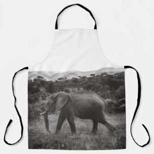 GRAYSCALE PHOTO OF GRAY ELEPHANT NEAR TREES APRON