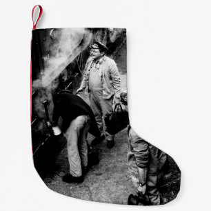 GRAYSCALE PHOTO OF MEN STANDING BESIDE 60163 TRAIN SMALL CHRISTMAS STOCKING