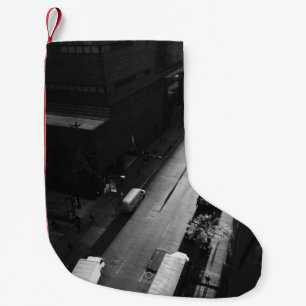 GRAYSCALE PHOTO OF PERSON WALKING ON ROAD OUTSIDE  SMALL CHRISTMAS STOCKING