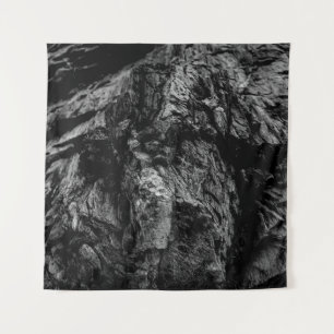 Grayscale photo of rock tapestry