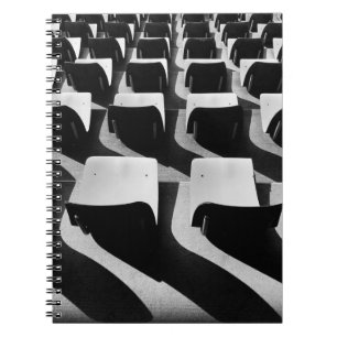 Grayscale photography of chairs with no people notebook