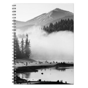 GRAYSCALE PHOTOGRAPHY OF LAKE NEAR PINE TREES NOTEBOOK