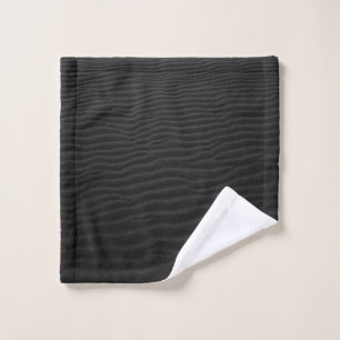 Grayscale photography of sand wash cloth