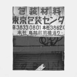 GRAYSCALE PHOTOGRAPHY OF STORE SIGN FLEECE BLANKET