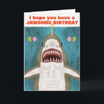 Great White Shark Funny Jawsome Birthday Pun Humou Card<br><div class="desc">The Great White Shark on this funny greeting card is so kind. See? It's smiling and hoping you have a jawsome birthday. It even brought balloons and is balancing a candle on its nose. The design includes a hand-drawn shark on a blue / sea green background with the silhouettes of...</div>