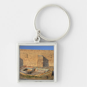 Greece, Santorini, Oia. Old fishing boat on dry Key Ring