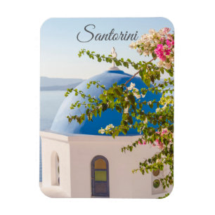 Greek church with a blue dome and colourful flower magnet