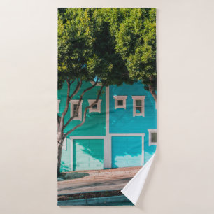 Green and blue houses beside trees on sidewalk bath towel