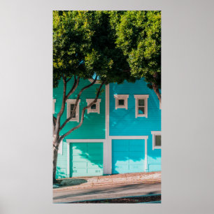 Green and blue houses beside trees on sidewalk poster