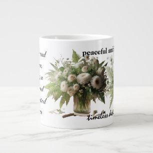 Green and white floral arrangements embody large coffee mug