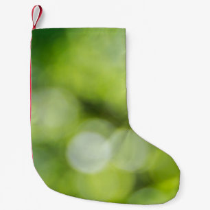 Green and yellow light bokeh small christmas stocking
