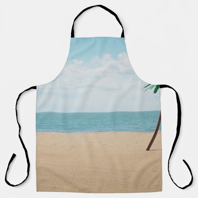 Green artificial palm tree on seashore apron (Front)