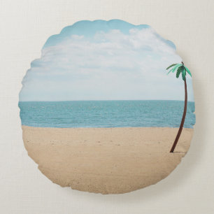 Green artificial palm tree on seashore round cushion