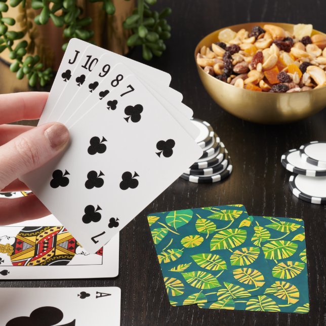 Green batik leaves pattern on blue playing cards (In Situ)