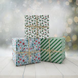 Green Blue Red Cute Cosy Christmas Patterns Wrapping Paper Sheet<br><div class="desc">Cute Christmas wrapping papers in three matching designs. One with snowmen,  Santas,  spruce needles,  steaming cups of cocoa,  and more. One with holly,  and one with green and white stripes.</div>