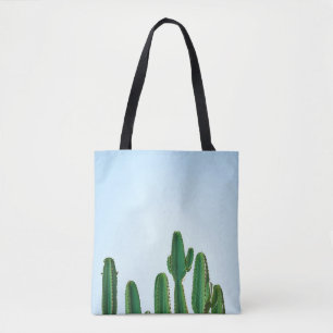 Green cactus plant in white background tote bag