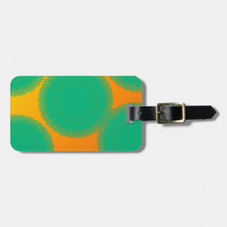 green circle in yellowish orange luggage tag