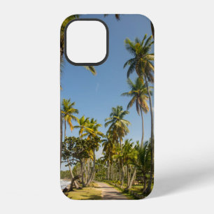 Green coconut palm tree near green grass field in iPhone 12 case
