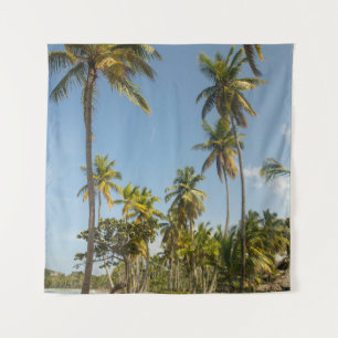 Green coconut palm tree near green grass field in tapestry