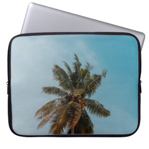 Green coconut tree under blue sky laptop sleeve
