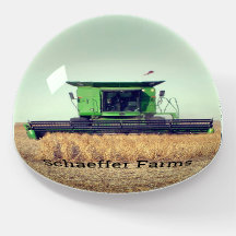 Green Combine in Wheat Field