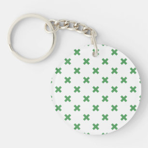 Green cross stitches on white key ring