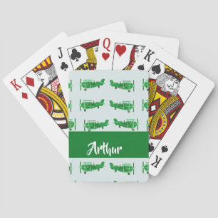 Green flying aeroplanes on blue playing cards
