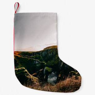 GREEN GRASS FIELD AND MOUNTAIN DURING DAYTIME SMALL CHRISTMAS STOCKING