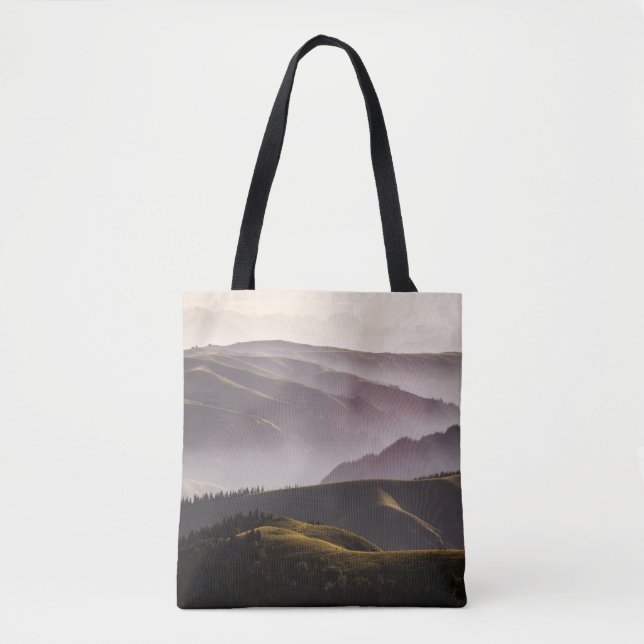 GREEN GRASS FIELD AND MOUNTAINS DURING DAYTIME TOTE BAG (Front)