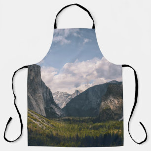 GREEN GRASS FIELD NEAR ROCKY MOUNTAIN UNDER WHITE APRON