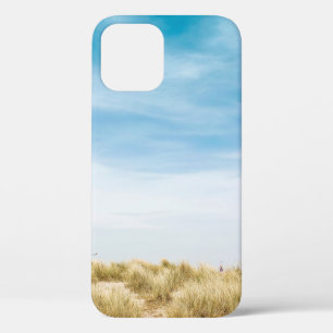 Green grass field under blue skies iPhone 12 case