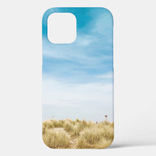 Green grass field under blue skies iPhone 12 case