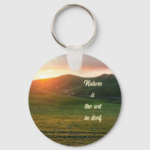 Green grassland during sunset keychain