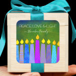 Green Hanukkah Blue Boho Candles Peace Love Light Square Sticker<br><div class="desc">“Peace, love & light.” A playful, modern, artsy illustration of boho pattern candles helps you usher in the holiday of Hanukkah. Assorted blue candles with colourful faux foil patterns overlay a rich, deep green textured background. Feel the warmth and joy of the holiday season whenever you use this stunning, colourful,...</div>