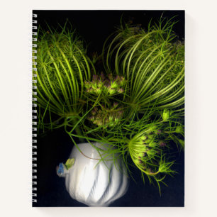 Green heart in black notebook