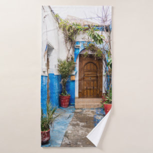GREEN LEAFED PLANT NEAR WALL BATH TOWEL