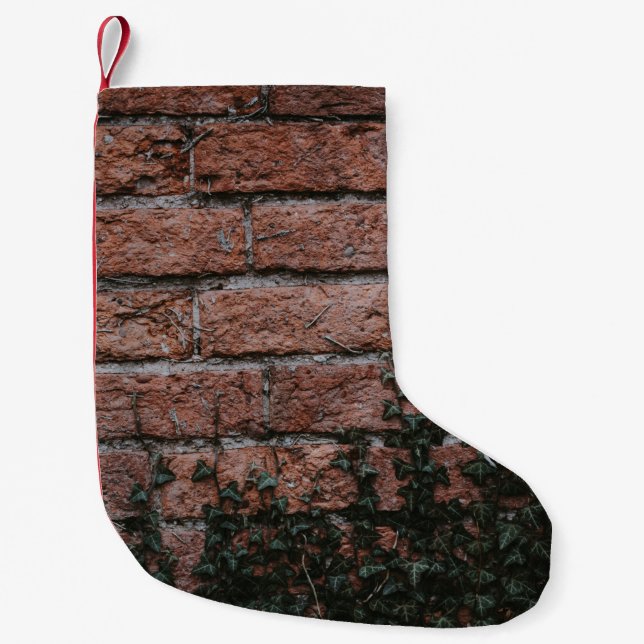 Green-leafed plants near brick wall small christmas stocking (Front)