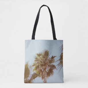 Green-leafed tree in the morning tote bag